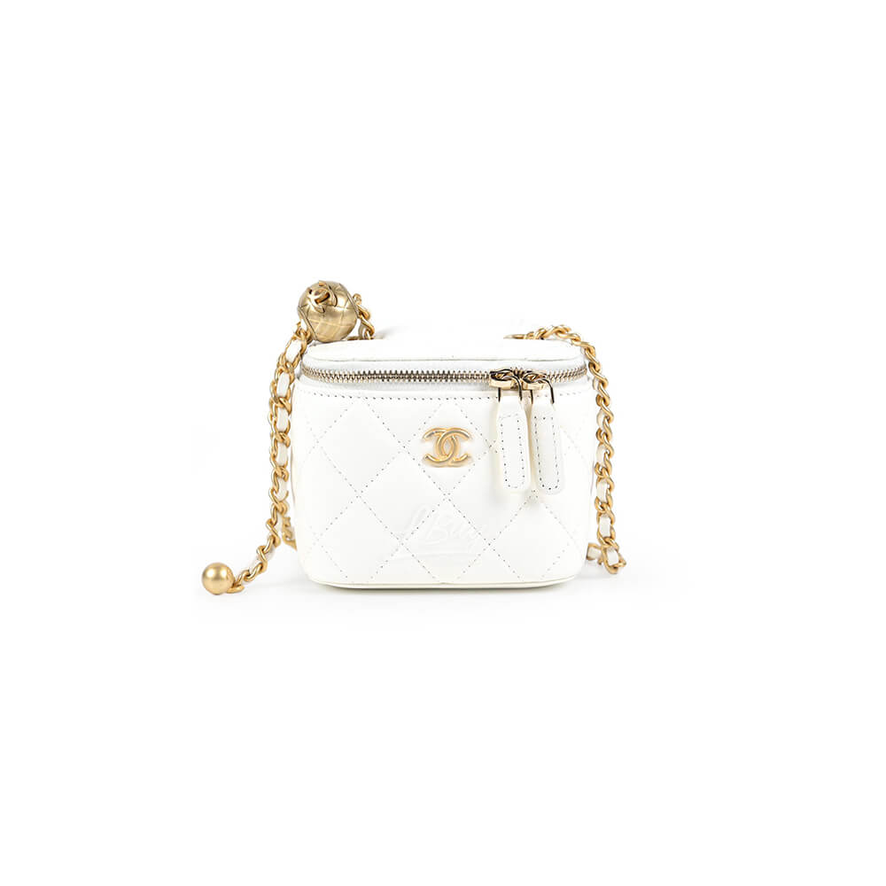 Chanel small gold ball makeup bag